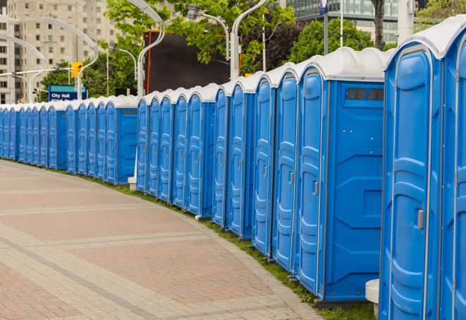 hygienic portable restrooms lined up at a music festival, providing comfort and convenience for attendees in Marion, IA